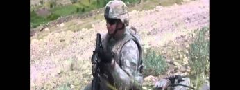 Specialist Mark D Talks to Bob Calvert in Afghanistan