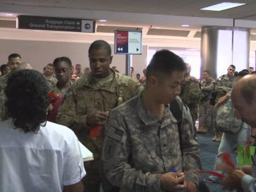 Watch Re-Deploying Troops Boarding Plane heading for DFW Airport